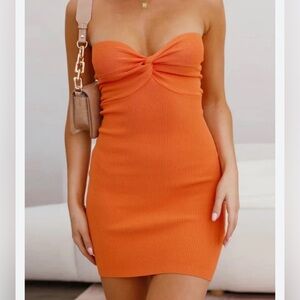Orange knit strapless mini dress